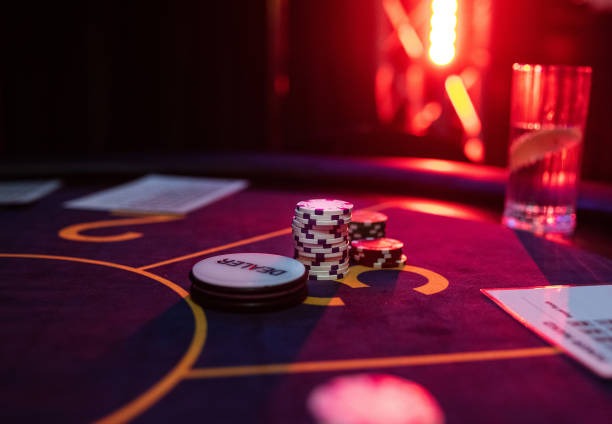 Live Three Card Poker dealer table with cards dealt and betting circles